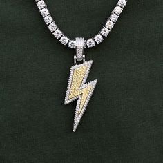 GLD's Exclusive "Iced Lightning Bolt" pendant is the first of its kind. Flooded in clear and yellow stones, this multi-layered piece shines from all angles with a reflective 3D effect. Worn stacked or solo, this piece is sure to stand out in a crowd. Boss up and flex with the GLD gang! This product is guaranteed for life - GLD will repair the item should you experience any defects in craftsmanship or breakage. Specifications - 1 x 1/2" (Width x Height) - Weight: (Weight can vary up to 2 grams) - Yellow Stone, Vermeil Jewelry, Custom Earrings, 3d Effect, Lightning Bolt, Pendant Bracelet, Drop Necklace, Chain Pendants, Men Necklace