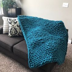 a couch with a blanket on top of it