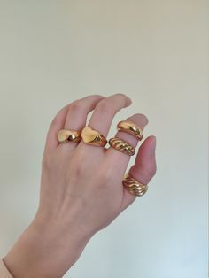 Because a lot of customer-friends love chunky rings, I made a collection of my wide rings. I hope you love these big golden rings. ♥ SIGN UP for 10% OFF your first order: https://bit.ly/3olIlWf ♥ DETAILS - Materials: Stainless steel, 18k gold plating. - Nickel-free, anti-corrosion, tarnish-resistant, and hypoallergenic. - Safe for sensitive skin. - Waterproof Ring: you can wear it while taking a shower or washing your hands. ♥ STYLE ⇨ A - Croissant Ring ⇨ B - Double Dome Ring ⇨ C - Themis Ring ⇨ Chunky Gold Rings Aesthetic, Big Gold Rings, Bulky Rings, Gold Chunky Rings, Big Gold Ring, Chunky Gold Rings, Skincare Christmas, 5 Gold Rings, Thick Rings