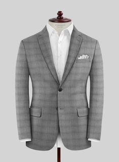 Unleash your inner style connoisseur with our curated London Loom Gray Bruna Wool Silk Linen Suit. Crafted with an infusion of high-class wool, silk, and linen, its plaid pattern embedded in a gray shade adds an aesthetically appealing touch to the attire, making it a go-to choice for any occasion. Whether worn at a classy evening dinner event or to make a bold statement in a professional setup, it mirrors the ambiance and amplifies your presence.   The  London Loom Collection   masterfully blends the durability of wool, the luxury of silk, and the breathability of linen, reflecting the elegance of English tailoring. This fabric offers season-spanning comfort, refined drapes, and natural coolness. Woven with traditional expertise, it stands as a testament to quality, style, and exquisite c Elegant Plaid Suit With Notch Lapel, Elegant Plaid Suit For Semi-formal Occasions, Timeless Plaid Suits For Tailoring, Luxury Plaid Suit For Formal Occasions, Luxury Plaid Single Breasted Suit, Luxury Fitted Plaid Suit, Elegant Plaid Business Suit, Timeless Plaid Suits For Formal Occasions, Timeless Plaid Formal Suits