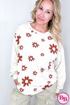 Introducing our Flower Power Mineral Washed Cotton Jersey Top, available in 3 colors. This lightweight pullover features a cute floral print, long sleeve, rounded neckline, and fun print. Layer it with a vest for a versatile look. With a pretty color combo and contrasting flowers, this top is both cute and stylish. With a variety of color options, our Flower Power Mineral Washed Cotton Jersey Top is a versatile addition to your wardrobe. Its floral print and contrasting colors make it cute and stylish, while its long sleeve and rounded neckline make it perfect for layering. Red Sweater For Spring Loungewear, Casual Printed Sweater For Spring, Casual Long Sleeve Printed Sweater, Cute Printed Tops For Fall, Cotton Floral Print Fall Sweater, Cotton Floral Print Long Sleeve Sweater, Oversized Floral Print Sweater, Fall Cotton Floral Print Sweater, Cotton Floral Print Sweater For Fall