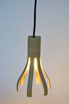 a light that is hanging from a wire with some lights on it's side