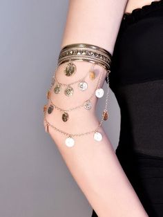 Elevate your cyberpunk style with our silver/gold chains arm cuff. This statement piece features intricate chain detailing, adding an edgy and futuristic touch to your look. Available in both silver and gold finishes, this arm cuff is perfect for adding a bold accent to any outfit. Embrace the cyberpunk aesthetic and stand out from the crowd with this eye-catching arm cuff.   Please note that this product includes only one arm cuff. Trendy Gold Metal Body Jewelry, Edgy Gold Jewelry For Festivals, Gold Chain Bracelets For Festival, Gold Chain Bracelet For Festival, Gold Metal Chain Bracelet For Festival, Gold Chain Cuff Bracelet In Metal, Metal Punk Cuff Bracelet For Festival, Punk Metal Cuff Bracelet For Festivals, Gold Festival Bracelet Body Jewelry