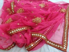 Neon Pink Lehenga dupatta for women wedding wear. Size: Dupatta is 100 inches (2.5 meter) long and 40 inches (1 meter) wide. Length of this dupatta can be customized as per your requirement. Fabric and work: Heavy sequins work net fabric with a mirror work lace border.Mirrors are not real they are foil mirrors. Delivery time: This dupatta will take 3-4 days to produce after we have received your order. While ordered with standard shipping it takes around 2-3 weeks in transit after we dispatch it Pink Dupatta, Dresses Handmade, Bridal Dupatta, Dark Red Dresses, Lehenga Suit, Rose Gold Dress, Golden Lace, Net Lehenga, Pink Lehenga