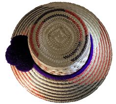 Elevate your style with our Handmade Wayuu Hat, a remarkable fusion of traditional artistry and contemporary fashion. Carefully crafted by skilled artisans from the Wayuu tribe, this hat is a testament to their expertise and cultural heritage. Made from authentic iraca palm fibers, each hat is a unique masterpiece, showcasing the beauty of handcrafted accessories. Features: Artisanal Excellence: The Handmade Wayuu Hat is meticulously handwoven by talented Wayuu artisans, who have honed their cra Handwoven Multicolor Brimmed Hats, Multicolor Handwoven Brimmed Hat, Multicolor Handwoven Toquilla Straw Hats, Artisan Handwoven Flat Brim Hat, Artisan Multicolor Fedora Straw Hat, Traditional Multicolor Fedora Hat, Artisan Multicolor Toquilla Straw Hat, Multicolor Artisan Toquilla Straw Hat, Artisan Hat Bands For Vacation