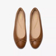 Womens Fawna Lily Tan Leather Ballerina Shoe | Clarks US Classic Slip-on Ballet Flats With Textured Sole, Cushioned Footbed Almond Toe Ballet Flats For Work, Cushioned Almond Toe Ballet Flats For Work, Cushioned Footbed Ballet Flats For Workwear, Cushioned Round Toe Ballet Flats, Elegant Ballet Flats With Textured Sole And Round Toe, Elegant Brown Flats With Bow, Classic Ballet Flats With Leather Sole, Chic Everyday Flats With Cushioned Footbed