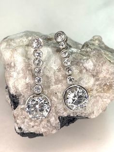 Thank you for viewing Wrenn Estate. These look like a million bucks! Bright cubic zirconia in 14 karat white gold. I've added the large ear lifter sterling silver backs which you will probably use on many of your earrings. They are great. 3.42 grams 14k white gold and cz 1 inch long Circa 1940 New sterling silver backs Amethyst And Diamond Ring, Cz Rings Engagement, Black Hills Gold, Pendant Watches, Cz Diamond, Sterling Earrings, Beautiful Bracelet, Sterling Silver Bracelets, Sterling Silver Earrings