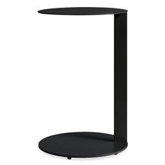 a black table with a round base and a circular shelf on one side that holds a phone