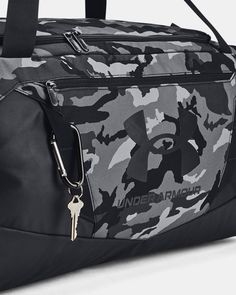 the under armour duffle bag is black and grey camo