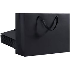 black paper bags stacked on top of each other