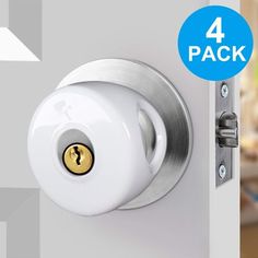 the door handle is white and has a lock on it, with four packs of 4