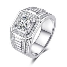 a white gold ring with diamonds on the sides and a square cut diamond in the center