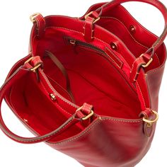 Effortlessly Chic    This structured satchel, made from Italian Vacchetta leather that grows softer with age, adds a ladylike chic look to outfits both day and night. Everyday Calf Leather Satchel, Timeless Red Satchel For Everyday Use, Red Timeless Satchel For Everyday Use, Timeless Red Satchel, Elegant Bucket Satchel, Leather-lined Bucket Satchel For Shopping, Elegant Bucket Shaped Satchel, Classic Bucket Satchel With Leather Lining, Timeless Red Leather Satchel