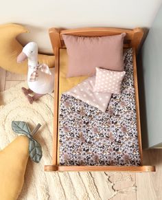 a baby crib with various items on the floor