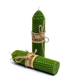 two green corn cobs wrapped in twine