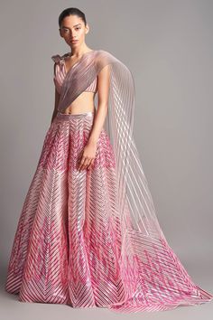 Blush pink structured lehenga with metallic stripes in chevron pattern and winged drape. Comes with corded hand embroidered blouse enhanced with 3D motifs.
Component: 3
Embroidered
Neckline: V Neck
Sleeve Length: Sleeveless
Fabric: Tulle
Color: Pink
Winged drape
Striped and chevron pattern
Closure: Blouse: Back hooks
Note: The dupatta worn by the celebrity is not for sale. - Aza Fashions Formal Pink Lehenga With Resham Embroidery, Designer Pink Wedding Sets, Pink Evening Set With Sheer Dupatta, Evening Pink Lehenga With Zari Work, Pink Organza Lehenga For Evening, Pink Choli With Sheer Dupatta For Evening, Evening Pink Choli With Sheer Dupatta, Pink Evening Choli With Sheer Dupatta, Pink Floor-length Evening Lehenga