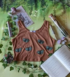 A brown tank top with embroidered moths. Designing Clothes, Cottagecore Outfit, Job Clothes, Future Clothes, Design Clothes, Clothing Manufacturer, Drawing Clothes, T-shirts & Tank Tops, Sustainable Clothing