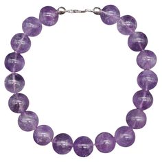 A simple, yet bold, amethyst bead necklace on a knotted string. Features a sterling silver clasp. Necklace is approximately 17 and 1/4 inches or 44cm. Each bead is approximately 3/4 inches. Marks / Hallmarks / Etc. : 925 Bead Collar Necklace, Beaded Collar Necklace, Clasp Necklace, Beaded Collar, Amethyst Beads, Retro Stil, Collar Necklace, Style Retro, Bead Necklace