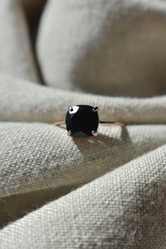 ---------------------------------------------- Black Onyx Ring. THE PRODUCT - Natural Onyx ring - Dimensions: 8x8mm, 3 cts - Handmade in the USA - The black onyx is a dainty 8mm square that we set in a .925 sterling silver band, or a gold option that is sterling silver in 14k gold fill. The gold we use is a very vibrant color. Finally we put a clear resin on the bottom of the stone to ensure an even longer product life and top it off with a polish, ensuring a beautiful natural ring! - Sustainabl Ring Black Stone, Diamond Ring Gold, Black Stone Ring, Dress Book, Nature Ring, Black Diamond Ring, Black Onyx Ring, Stylish Dress Book, Ring Black