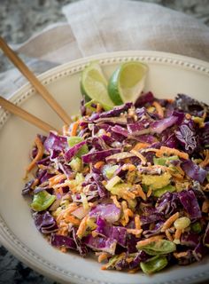 a white bowl filled with coleslaw and carrots