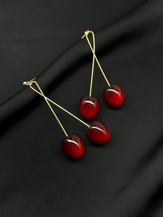 Cherry earrings are a stylish and unique accessory that immediately catches the eye. They are made with two red beads resembling juicy cherries. These earrings are a perfect addition to your look, adding a touch of playfulness and freshness. They are ideal for the summer season, suitable for everyday wear as well as various parties, creating a light and bright accent. Affordable Elegant Cherry Earrings, Elegant Cherry Colored Jewelry For Party, Elegant Cherry Drop Earrings, Cherry Colored Jewelry For Valentine's Day Party, Cherry-colored Jewelry For Valentine's Day Party, Cherry Color Jewelry For Valentine's Day Party, Cherry Jewelry For Valentine's Day Party, Cherry Dangle Earrings For Party, Cherry Color Dangle Earrings For Party