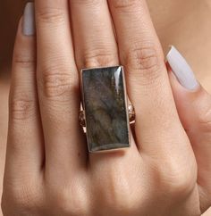 "Labradorite Ring / 925 Sterling Silver Ring / Rectangle Shape Ring / Large Gemstone Ring / Handmade Labradorite Ring / Women Silver Jewelry Gemstone Name - Labradorite Stone Quality - AAA Ring Wight - 11.49 gm  Length - 3 cm   Width - 1.5 cm  Stone Shape - As shown in the picture Ring Size - All Ring Size Available You'll get the exact product as shown in the pictures We serve complete 925 sterling silver Jewelry and genuine properties of the stone. The products are dispatched from the small business from USA. Product Quality and Packaging - Our all products are 925 Silver Stamped which shows that the product is genuine and authentic .The products are dispatched from the small business from USA so you get the product on time and the product packaging comes in bubble foil wrap with all the Rectangular Moonstone Ring For Anniversary, Unique Rectangular Anniversary Rings, Unique Rectangular Gemstone Ring, Unique Rectangular Rings With Natural Stones, Unique Rectangular Natural Stone Rings, Silver Rings With Rectangular Natural Stones, Sterling Silver Rings With Natural Stones In Rectangular Shape, Ring Rectangle, Picture Ring