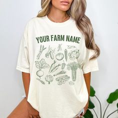 Vegetable Shirt Personalized Farm Shirt Custom Veggie Graphic Print TShirt Vegan Shirt Cottagecore Vintage Farmers Market Tee Gardening Comfort Colors  ❤ Our Luxury T-shirts are pure comfort! Each piece is thoughtfully designed as UNISEX, ensuring a perfect fit in true UNISEX sizes. And of course, you can elevate your style with an effortlessly oversized look by ordering 1 or 2 sizes up. ❤ Select your favorite shirt color and font to create a personalized design! ❤Our commitment to quality is reflected in our use of a high-grade ink printing method, delivering graphics with a sharp and crisp appearance. The ink seamlessly integrates with the fibers, ensuring both vibrant visuals and remarkable durability for your apparel. ❤ Luxury Comfort Colors Brand ❤100% cotton - premium quality, medium Organic White Crew Neck Tops, Organic White Short Sleeve Tops, Organic Relaxed Fit Crew Neck Tops, Organic Cotton Crew Neck Tops, Organic White Crew Neck T-shirt, Organic White Graphic Print Tops, Organic Green Short Sleeve Top, Vintage Farmers Market, Graphic Print Tshirt