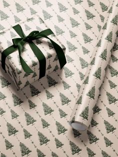 a present wrapped in wrapping paper with a green ribbon