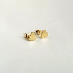 Simple and sophisticated, our minimalist stud earrings are beautifully plated in 18k gold and perfect for everyday wear. · 18k gold plated brass · Push back closure · 8mm Minimalist Stud Earrings, Minimalist Earrings Studs, Minimalist Studs, Heart Stud Earrings, Heart Studs, Gems Jewelry, Heart Earrings Studs, Minimalist Earrings, Gold Studs