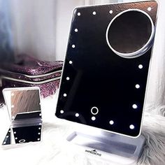 Bundle Mirror: With this beautiful bundle mirror you can simply decorate your vanity space as well as you can use this bifold small mirror as travel. It is a complete package for your daily makeup work. Touch XL Mirror: This beauty makeup mirror comes from 20 bright LEDs with adjustable brightness. Included a storage section to store your makeup small accessories also has a detachable 5x magnifying mirror. Touchup Mirror: This compact mirror has built in 8 LED lights with adjustable brightness. Emma Vanity, Face Mirror, Lighted Vanity, Bedroom Makeup Vanity, Table Vanity, Classic Mirror, Impressions Vanity, Shaving Mirror, Led Makeup Mirror