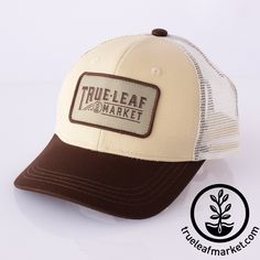 a trucker hat that says true - leaf market on the front and brown mesh back