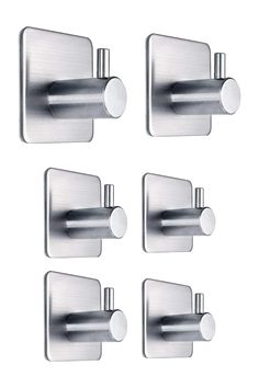 four stainless steel door handles on a white background