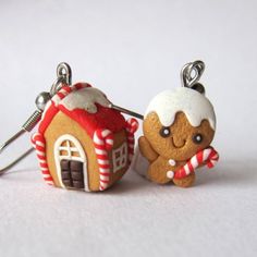 two small gingerbread houses with candy canes on them