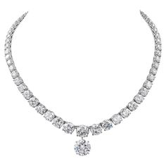 Haute-joaillerie diamond necklace riviera style with a diamond pendant. The necklace is comprising of 67 graduated round-cut diamonds, mounted in platinum. 16 diamonds are GIA certified weighing from 0.73 carats to 3 carats. The colors are from D to F, clarity from IF to SI1. The center diamond in the necklace is 3 carats, F VVS2. A copy of the GIA report is attached to the pictures. Pendant is a 6.54 carat round diamond F VVS1. Certified by GIA. Total weight of diamonds in the necklace is 44.72 carats. Total weight of diamonds including pendant is 51.26 carats. Metal is platinum; gross weight 60 grams. Length of the necklace without the pendant is 15 1/4 inches. The copies of all the GIA reports will be provided upon request. 1stdibs Diamond Necklace, Luxury Platinum Diamond Pendant Necklace, Luxury Gia Certified Collectible Jewelry, Luxury Refined Diamond Necklace With Prong Setting, Luxury White Gold Necklace With Gemstone, Luxury Dazzling Diamond Necklace With Prong Setting, Luxury Platinum Diamond Necklace With Halo Setting, Luxury Fine Jewelry Three Stone Necklace, Luxury Fine Jewelry Necklace With Three Stones