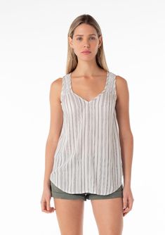 [Color: Off White/Black] A front facing image of a blonde model wearing a casual bohemian spring tank top in an off white and black stripe. With a v neckline Striped V-neck Tank Top, Striped V-neck Tank Top For Spring, Striped V-neck Summer Tops, Casual Striped Sleeveless Tank Top, Striped V-neck Vest Top, Casual Striped Tank Top For Day Out, Summer Sleeveless Striped Top, Striped Sleeveless Summer Top, Striped Sleeveless Blouse For Summer