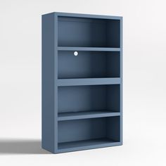 a blue bookcase with three shelves on each side and an object in the middle