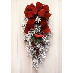 a christmas wreath hanging on the front door