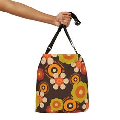 Suit up for the summer in style with our 70's Hippie Mod Daisy tote bag. This Chocolate Brown, Retro Adjustable Tote Bag is sure to make a statement wherever you go. Brilliantly constructed with 100% spun polyester, two sizes and an adjustable strap, it's the perfect accessory to bring along on your summer adventures! Plus, with a zippered closure, black interior lining and inner pocket, you'll feel safe and secure while you're out and about. So don't wait – grab yours today and get ready to tur Retro Square Shoulder Bag For Everyday, Retro Tote Bag With Removable Pouch, Retro Tote Bag For Everyday Use, Retro Square Shoulder Bag For Travel, Retro Multicolor Shoulder Bag For On-the-go, Retro On-the-go Tote Bag, Retro Shoulder Bag For Shopping, Retro Travel Bags For Summer, Retro Square Shoulder Bag With Removable Pouch