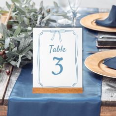 a table with place cards and plates on it