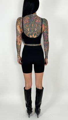 We love a solid biker short action. Super stretchy and comfy and holds errrrthang in. These babies are ribbed (for her pleasure). IYKYK. Just a little added touch to take a basic biker short to the next level. Perfect to pair with your favorite oversized graphic tee or under a mini dress so your kitty isn't saying hi to everyone. Fit: True to size Model is: Height: 5'6" Waist: 25” Hips: 31.5" Chest: 32C Wearing size S/M Material: 92% Nylon 8% Spandex Paired with: Valencia V Brami Apparel size ch Trendy High Stretch Ribbed Activewear, Trendy Ribbed High-stretch Activewear, High Stretch Above Knee Biker Shorts For Yoga, Sporty Stretch Short Top, Stretch Ribbed Shorts For Loungewear, Ribbed Stretch Shorts For Loungewear, Short Compression Tops For Yoga, Edgy Stretch Shorts, High Stretch Seamless Shorts For Loungewear