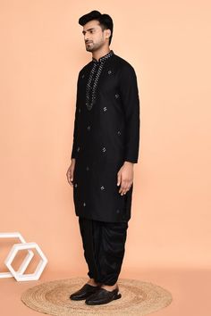 Black straight kurta with mirror embroidered buttis. Paired with black dhoti pant. - Aza Fashions Black Unstitched Suit With Zari Work For Navratri, Black Unstitched Suit With Traditional Drape For Navratri, Unstitched Black Suit For Navratri With Traditional Drape, Black Unstitched Suit For Designer Wear, Navratri, Black Designer Unstitched Suit For Navratri, Black Designer Wear Unstitched Suit For Navratri, Black Mirror Work Sets For Eid, Black Mirror Work Sets For Diwali, Black Sets With Mirror Work For Diwali