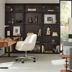 a chair and desk in front of a bookcase