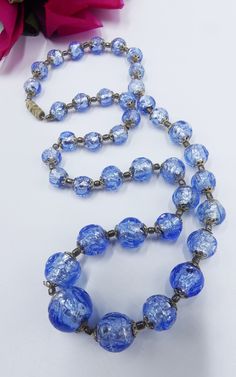 Vintage Venetian blue glass w silver foil beads necklace, In good vintage condition, The chain 21"1/2 long. The beads from 8 mm to 15 mm in diameter. Weighs 2 Oz. Thanks. Luxury Vintage Blue Beaded Necklace, Vintage Blue Glass Beaded Necklaces, Vintage Blue Necklaces With Polished Beads, Vintage Blue Glass Necklace, Vintage Blue Single Strand Beaded Necklaces, Vintage Blue Single Strand Beaded Necklace, Vintage Blue Single Strand Necklace, Vintage Blue Round Beaded Necklace, Vintage Blue Beaded Necklace