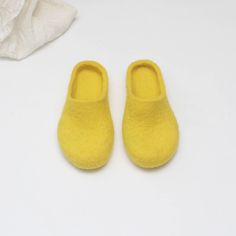 Felted slippers for women of bright yellow wool - an excellent gift for Christmas, birthday or housewarming. Felt is a perfect material for footwear. It is extremely wear-proof and warm. When you put them on, you won't want to take the slippers off. They will definitely make a part of your home outfit. Non-slip sole is covered with natural latex. Now slippers are also available in rubber soles. Please follow the link if interested https://www.etsy.com/listing/100254500/rubber-soles-for-felted-sl Comfortable Yellow Slip-on Slippers, Comfortable Yellow Flat Slippers, Yellow Slip-on Winter Slippers, Yellow Non-slip Slippers With Round Toe, Comfortable Yellow Round Toe Slippers, Yellow Non-slip Round Toe Slippers, Comfortable Yellow Non-slip Slippers, Comfortable Non-slip Yellow Slippers, Yellow Slip-on Casual Slippers