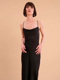 Ginny is an update on our classic Riviera in a gorgeous new maxi-length. She's got the same cowl neck and backless lace-up detail and is crafted from our signature slinky satin made using 100% recycled polyester. In a sultry black shade, Ginny is the perfect dress for when you feel like keeping it paired-back but chic. Fitted Satin Midi Dress With Cowl Back, Chic Maxi Dress With Ruched Cowl Back, Fitted Cowl Back Bias Cut Midi Dress, Fitted Slip Dress With Back Opening For Date Night, Fitted Midi Dress With Bias Cut And Cowl Back, Fitted Bias Cut Midi Dress With Cowl Back, Date Night Maxi Dress With Cowl Back, Cowl Back Maxi Dress For Date Night, Fitted Maxi Dress With Cowl Back For Night Out