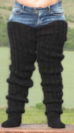 "HAND KNITTED STOCKINGS / HUGE UNISEX SOCKS ### DESIGNED & CREATED by Giorgio Qualitat ### Product Specification: § Color: Black; § Style: Hand knitted ribbed mohair stockings; § Material: 2 strands premium class longhair mohair; Size & Measurements: § Length from heel to upper end: 47.6 \" / 121 cm; § Circumference at the upper end: 17.3 '' / 44 cm § Length from toe to heel: 12.2 '' / 31 cm § Net weight: 567 g* All measurements are taken with the item laid flat and not stretched. The lady model Black Knitted Socks For Stocking Stuffer, Black Knitted Stretch Knee-high Socks, Black Stretch Knitted Knee-high Socks, Cozy Black Knitted Socks, Black Warm Leg Warmers One Size, Black One-size Warm Leg Warmers, Comfortable Black Knee-high Socks For Winter, Black Warm One-size Leg Warmers, Cozy Black Thigh High Leg Warmers