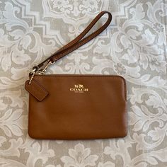 New Coach Wristlet* Chestnut Colored Leather Wristlet. Brand New, Never Used!!! Excellent New Condition! Great For A Night Out! Classic Coach Wristlet With Wrist Strap, Brown Wristlet With Removable Pouch As Gift, Coach Wristlet With Wrist Strap, Classic Brown Coach Clutch, Brown Coach Bag With Wrist Strap, Classic Brown Wristlet For Everyday Use, Brown Wristlet With Zipper For Everyday Use, Brown Wristlet With Zipper Pouch For Gift, Brown Wristlet With Zipper Closure For Everyday