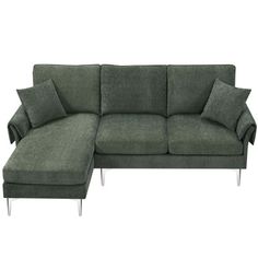 a green sectional sofa with pillows on it's back and arm rests in front of a white background