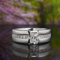 a wedding ring set with a princess cut diamond