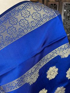 Gorgeous Blue Soft Banarasi Dupatta. Dupatta is Soft and will add beauty to any Outfit. Makes a Perfect Gift! Item: Dupatta Color : Blue Fabric : Banarasi Silk (Not Pure Silk) Work : Zari Weaved with tassels Size : Full Size Dupatta Length of the Dupatta : 92 inches approx. Width of the dupatta : 35 1/2 inches (Approx.) Blue Traditional Wear For Diwali, Traditional Blue Wear For Diwali, Festive Blue Dupatta With Traditional Patterns, Blue Saree With Motifs For Puja, Elegant Blue Dupatta With Pallu, Blue Handloom Traditional Wear For Festive Occasions, Blue Saree With Motifs For Diwali, Elegant Blue Handloom Dupatta, Blue Katan Silk Traditional Wear For Festive Occasions